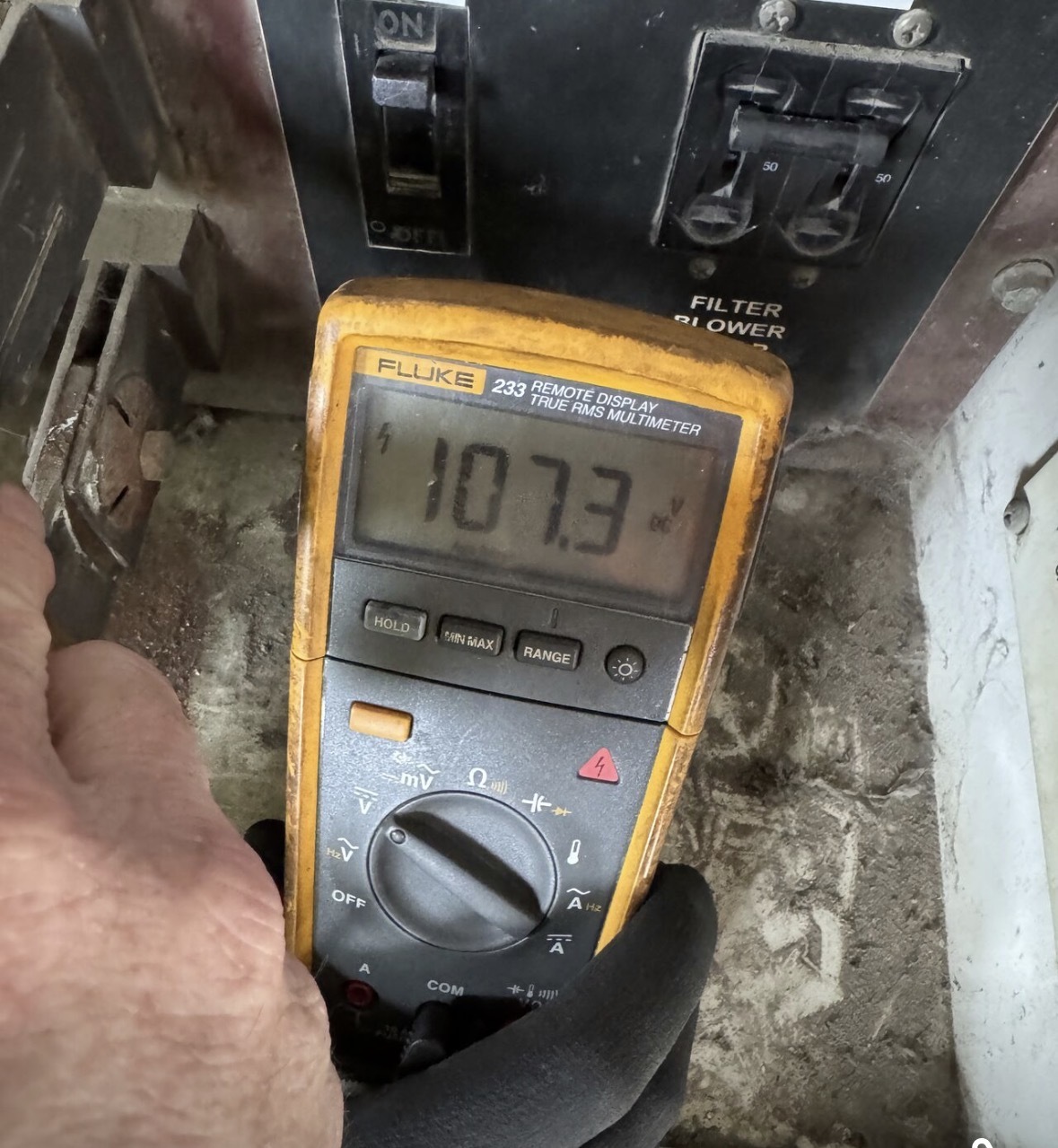 Meter documenting an abnormal voltage reading during railroad battery-system diagnostics