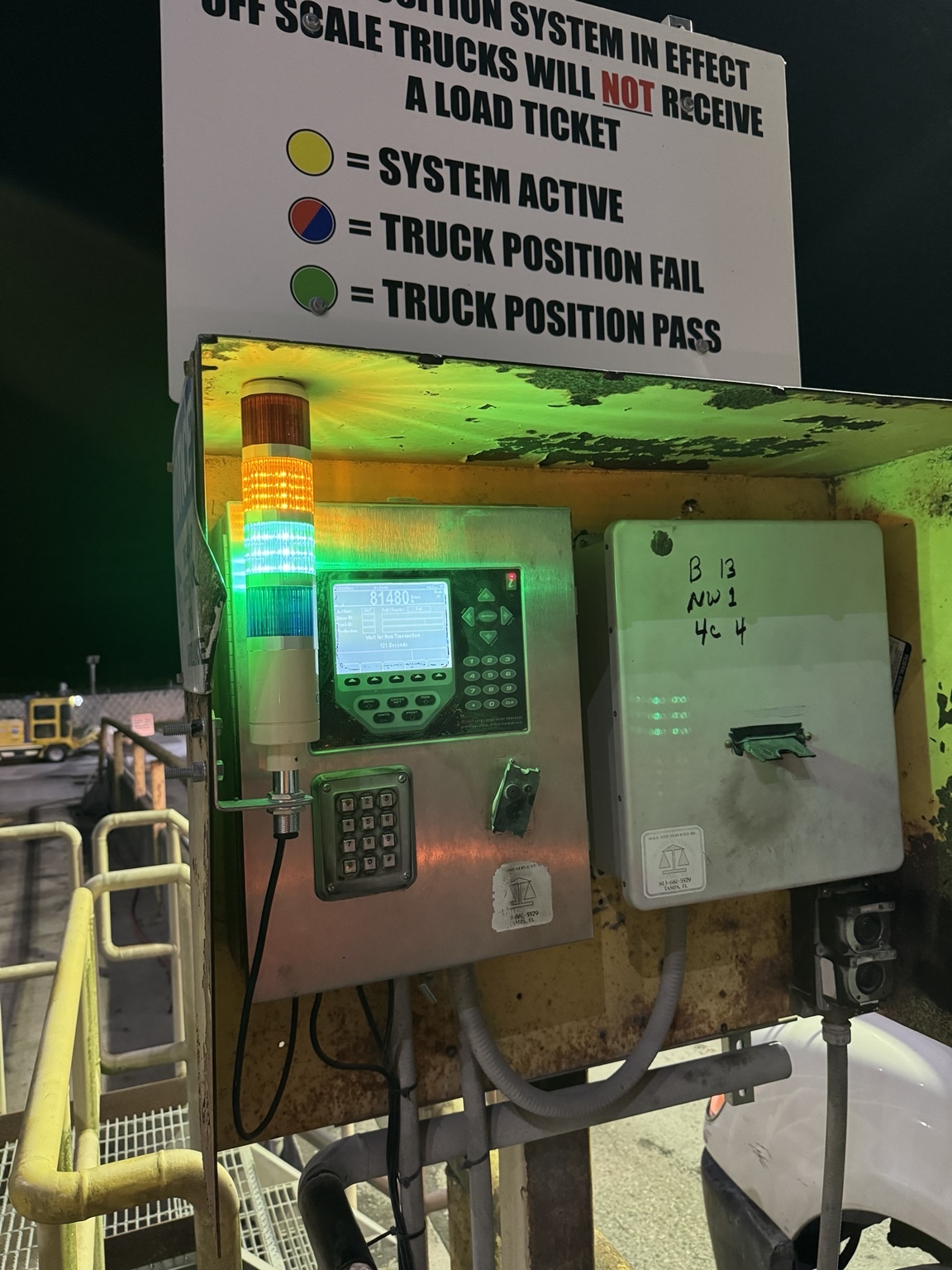 Close view of the truck scale terminal and illuminated status tower